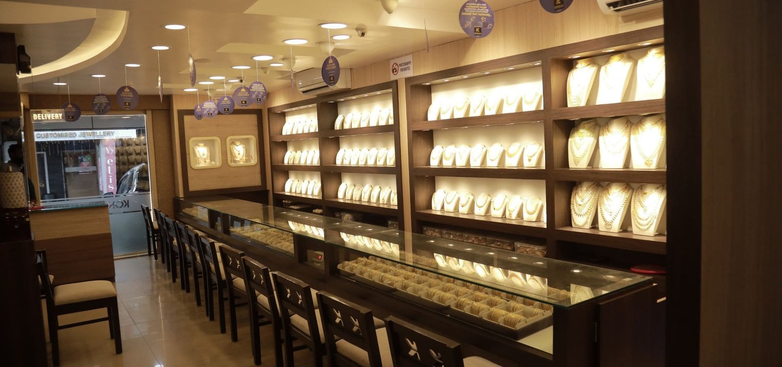 Inside the Vasundhara Diamond Roof showroom — illuminated diamond display counters, Jubilee Hills Hyderabad